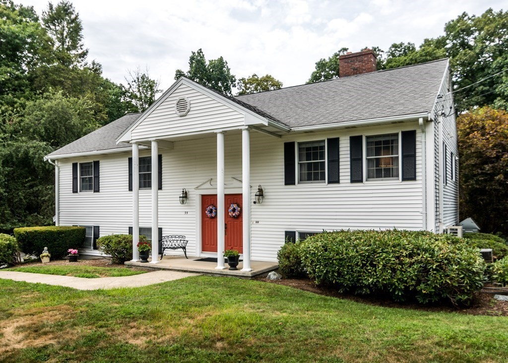 35 Woodchester Road Waltham, MA 02451 - Photo 3 of 39 a view of a house with a garden and plants