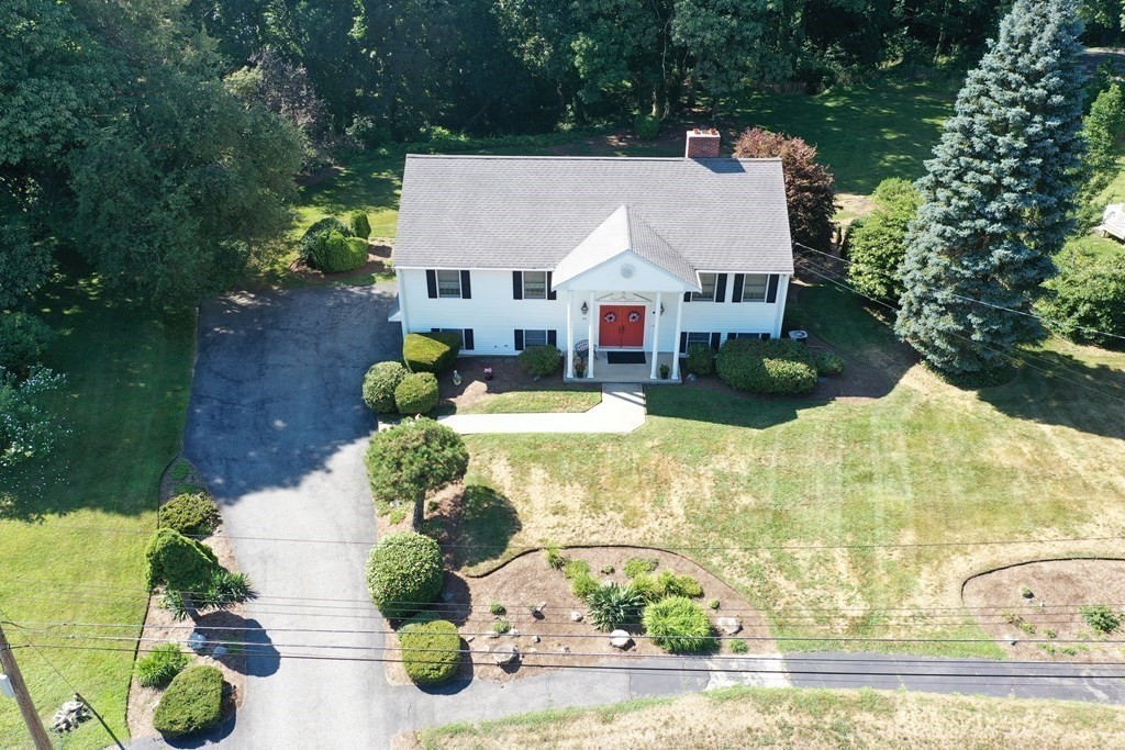 35 Woodchester Road Waltham, MA 02451 - Photo 34 of 39 an aerial view of a house with a yard and potted plants