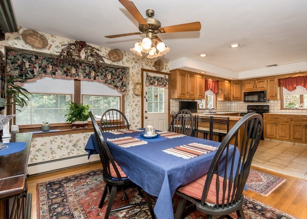 35 Woodchester Road Waltham, MA 02451 - Photo 8 of 39 a view of a dining room with furniture window and wooden floor