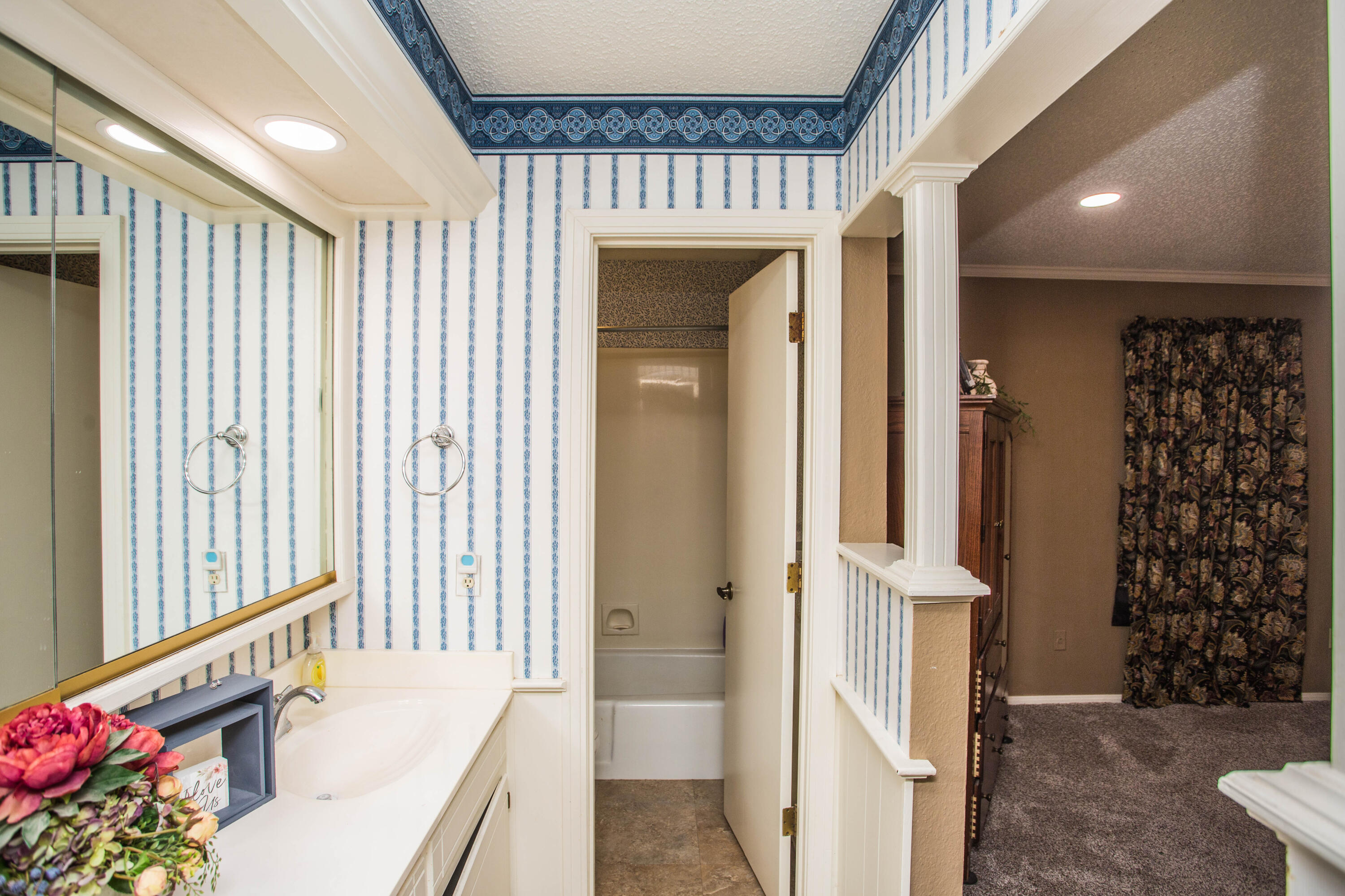 1304 Jefferson Drive Plainview, TX 79072 - Photo 19 of 50 a view of a hallway with a dining room and stairs