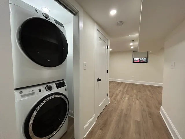 a view of a hallway with washer and dryer