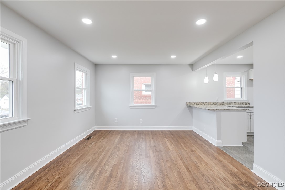 1910 Ridgemont Road Richmond, VA 23224 - Photo 6 of 28 Unfurnished room featuring a wealth of natural lig