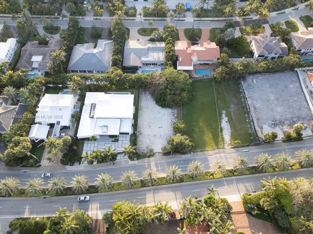 an aerial view of house with a yard