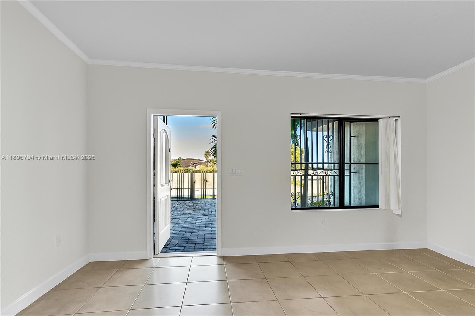27109 Southwest 133rd Court Homestead, FL 33032 - Photo 11 of 48 a view of a room that has a window