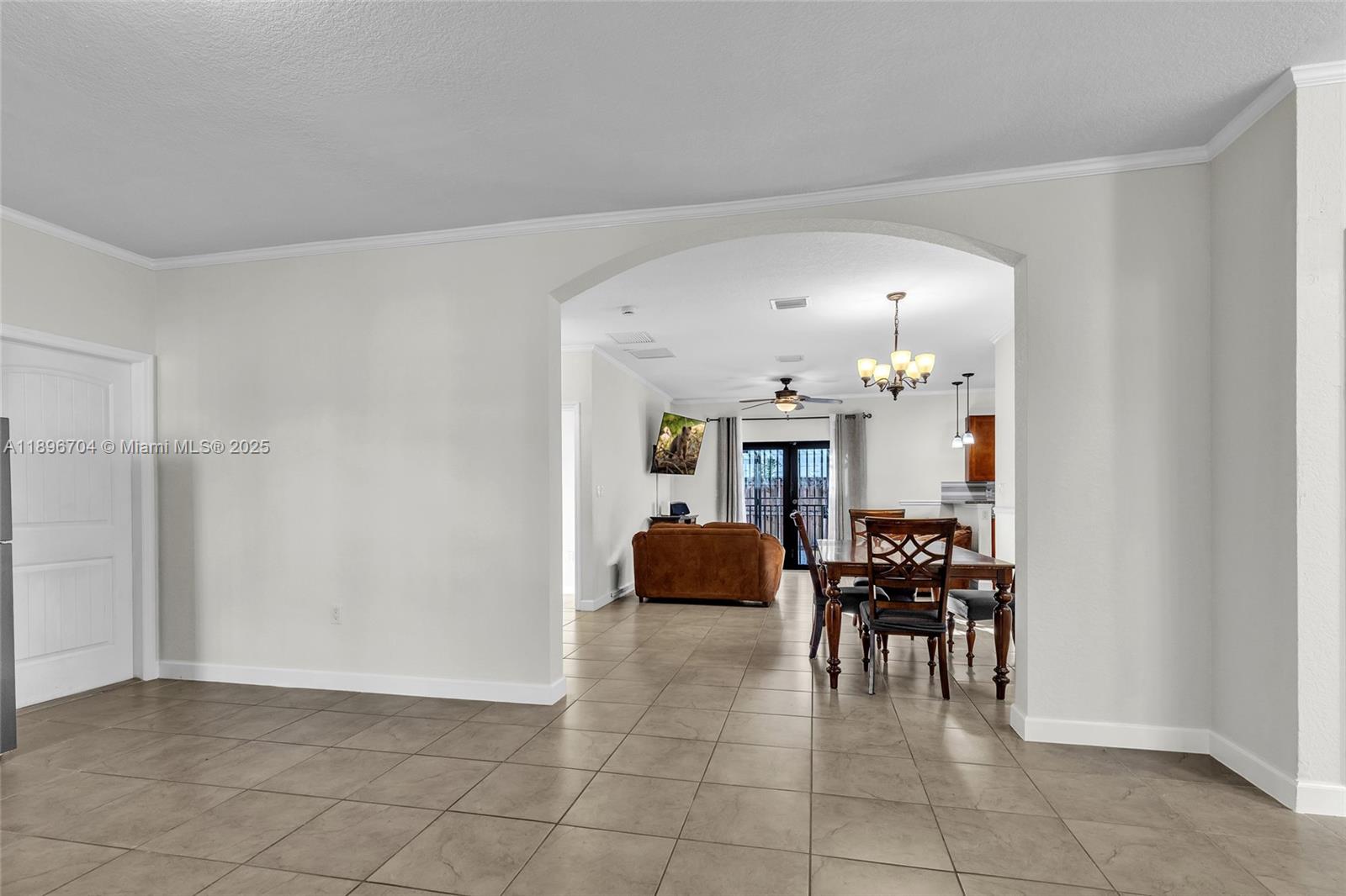 27109 Southwest 133rd Court Homestead, FL 33032 - Photo 13 of 48 a dining room with furniture and entryway