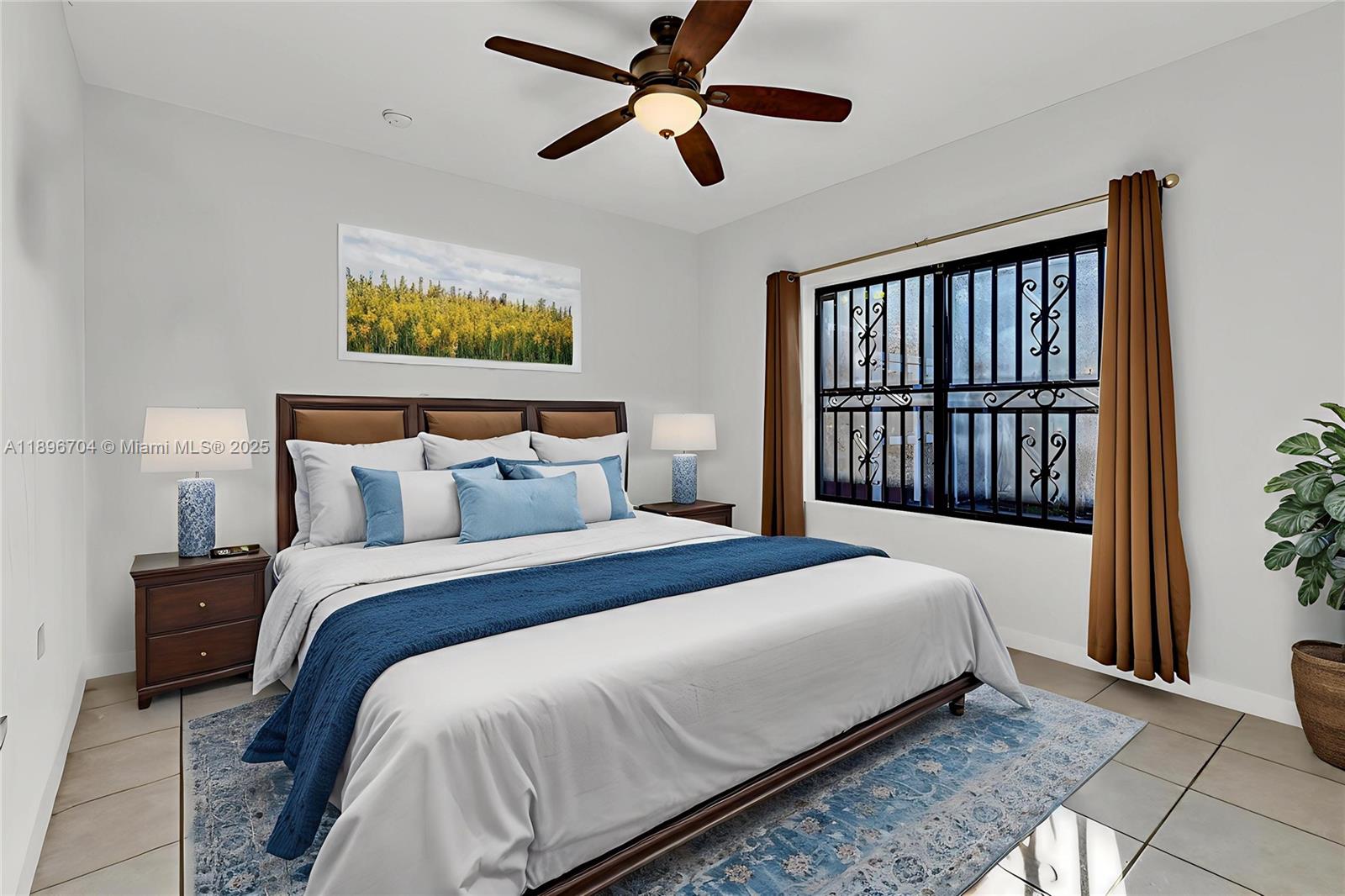 27109 Southwest 133rd Court Homestead, FL 33032 - Photo 24 of 48 a bedroom with bed and window