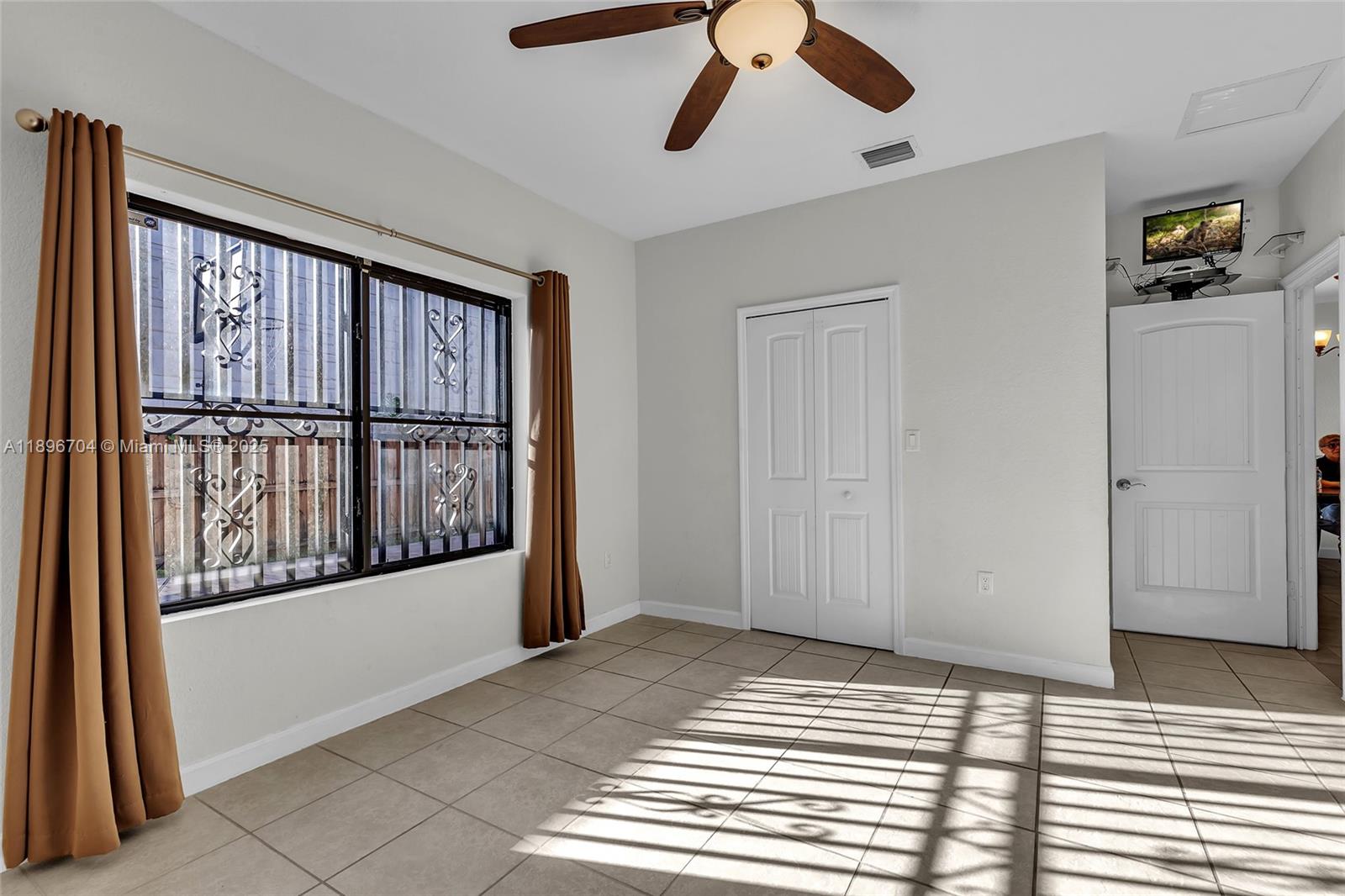 27109 Southwest 133rd Court Homestead, FL 33032 - Photo 26 of 48 a view of a room with wooden floor and windows