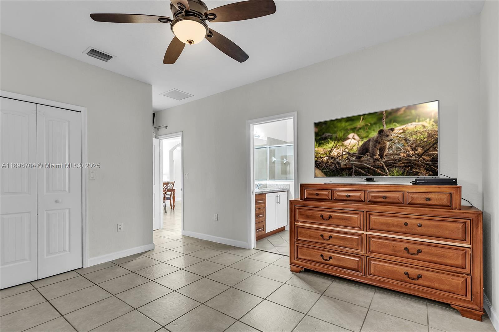 27109 Southwest 133rd Court Homestead, FL 33032 - Photo 27 of 48 a living room with furniture and a flat screen tv