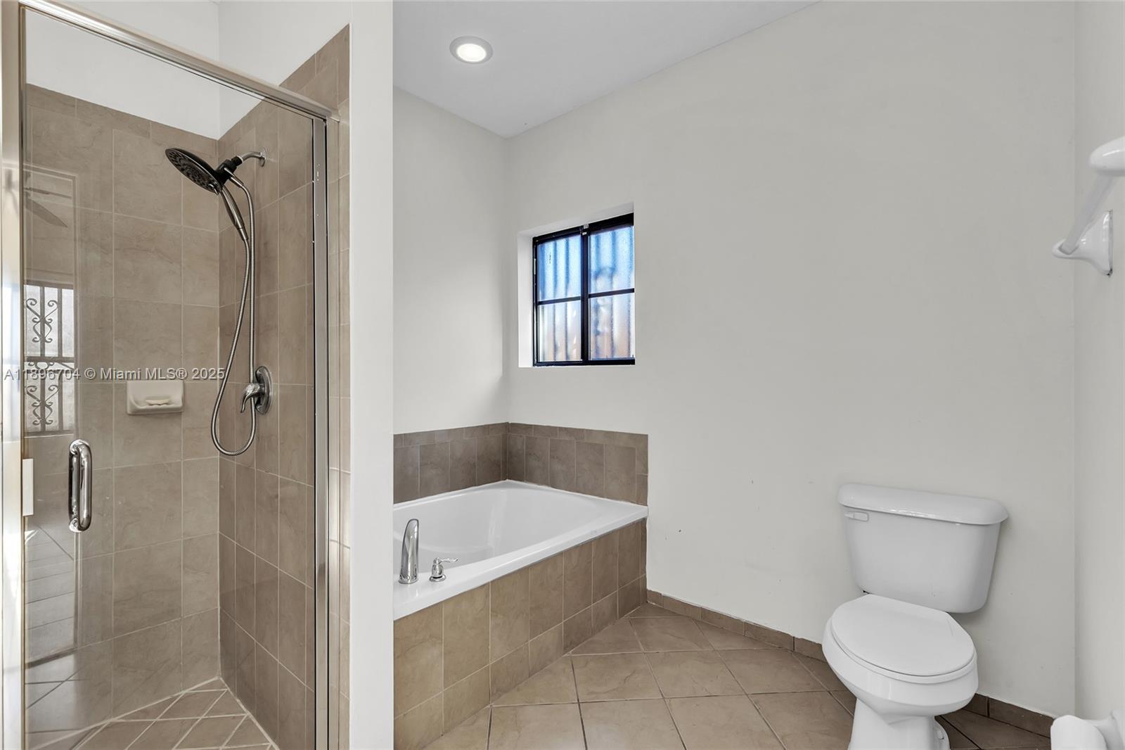 27109 Southwest 133rd Court Homestead, FL 33032 - Photo 31 of 48 a bathroom with a toilet and a shower