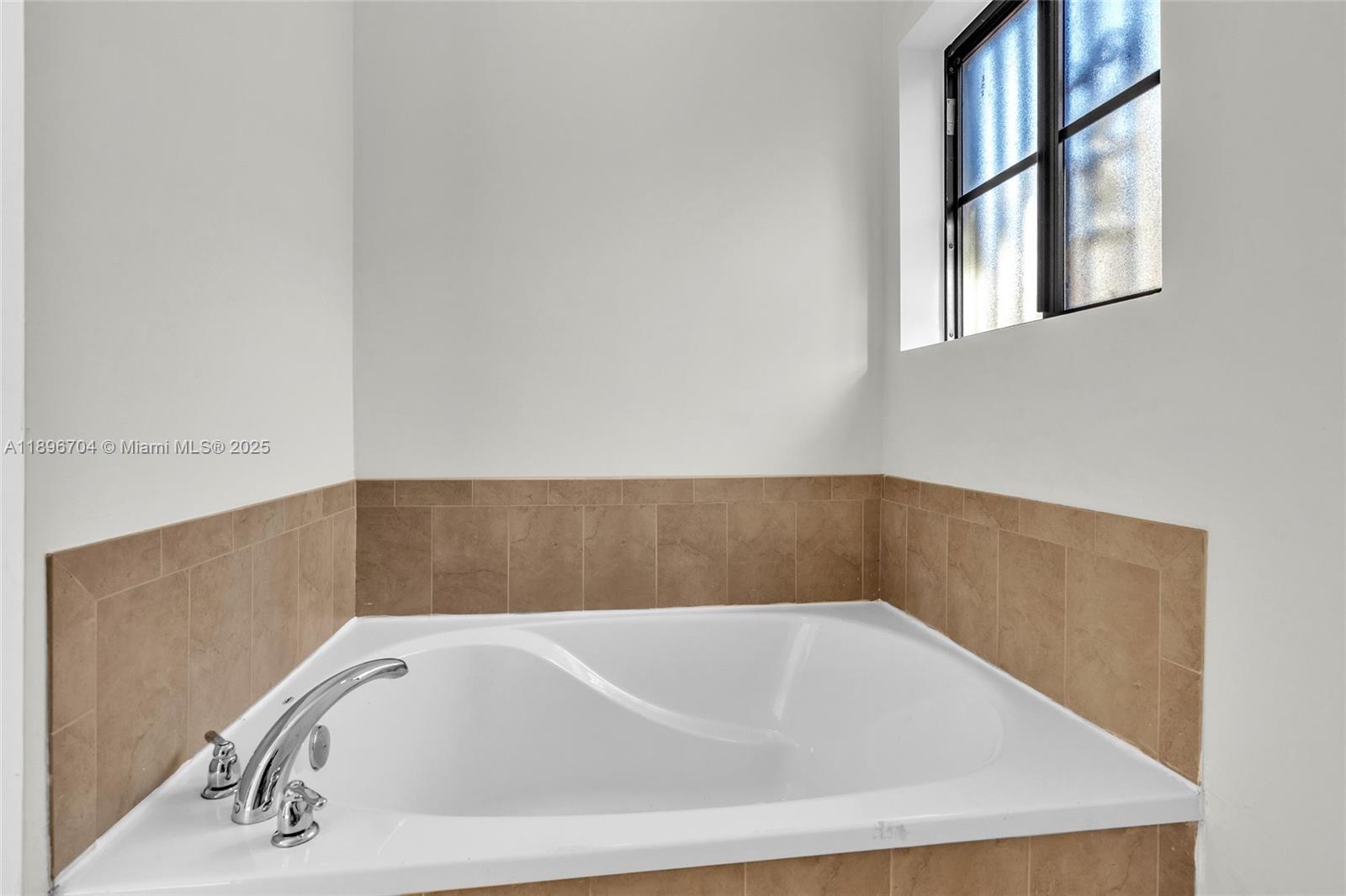 27109 Southwest 133rd Court Homestead, FL 33032 - Photo 32 of 48 a bathroom with a bathtub