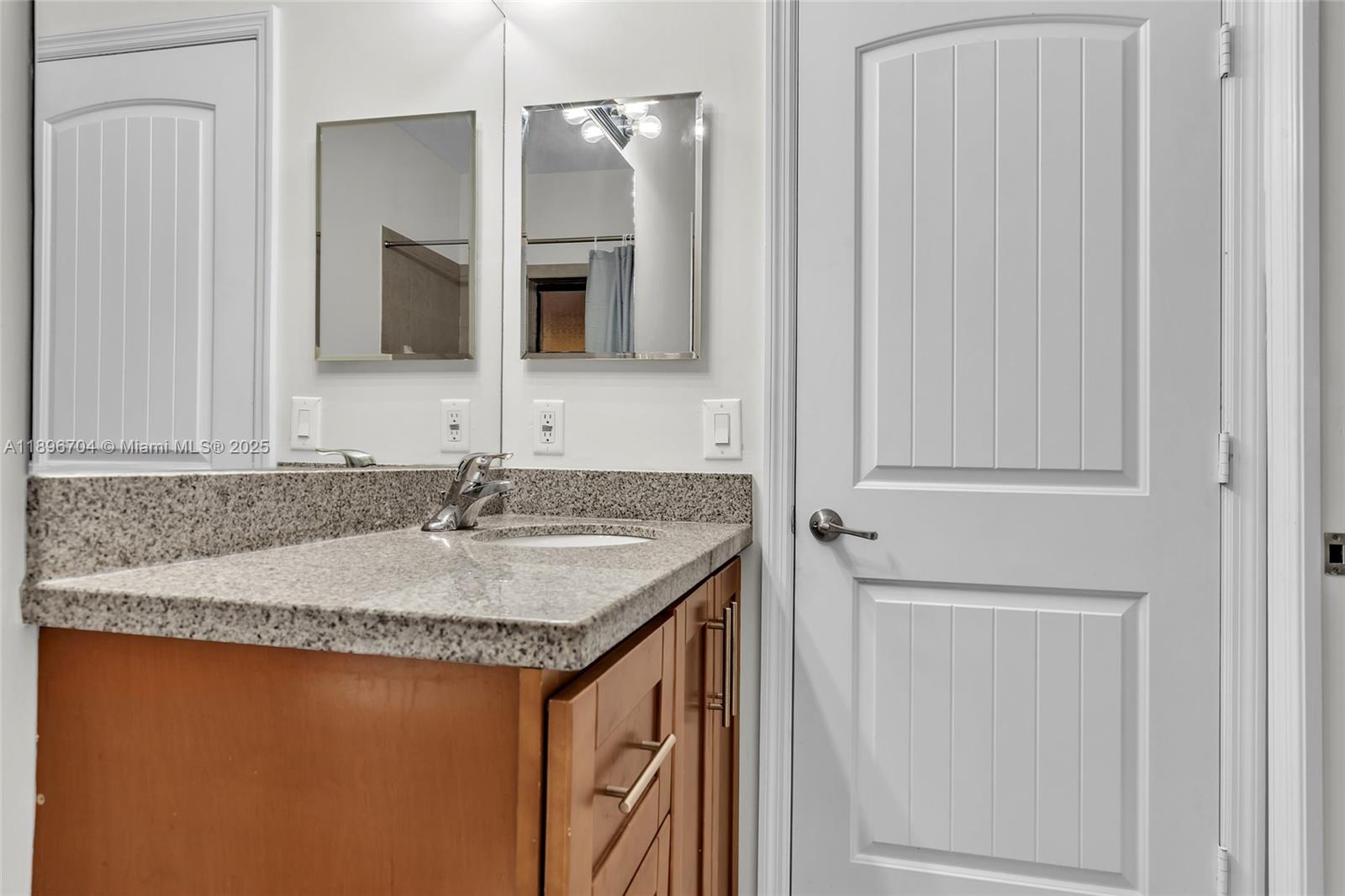 27109 Southwest 133rd Court Homestead, FL 33032 - Photo 36 of 48 a bathroom with a granite countertop sink and a mirror