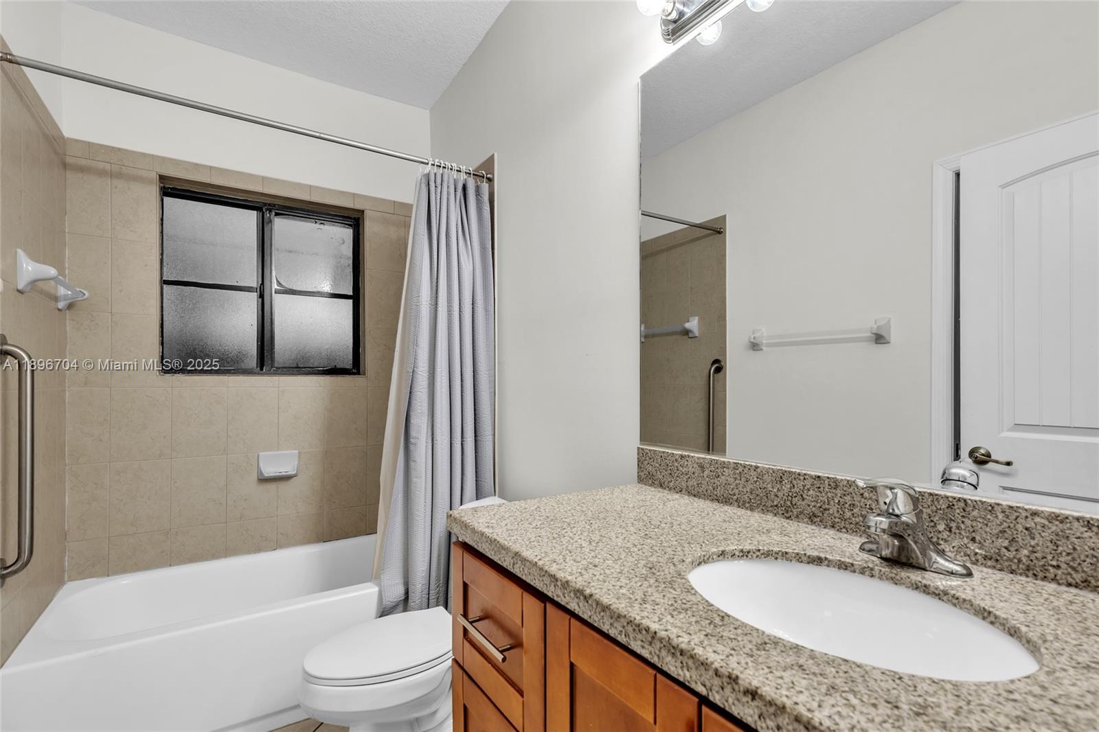 27109 Southwest 133rd Court Homestead, FL 33032 - Photo 37 of 48 a bathroom with a granite countertop sink toilet and shower
