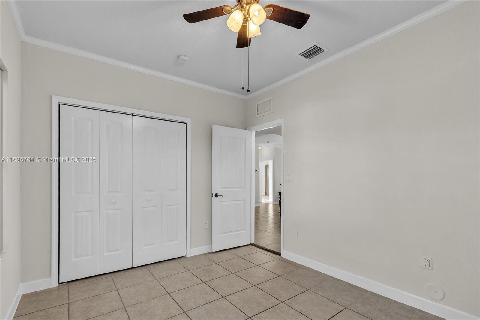 27109 Southwest 133rd Court Homestead, FL 33032 - Photo 39 of 48 a view of an empty room and chandelier fan