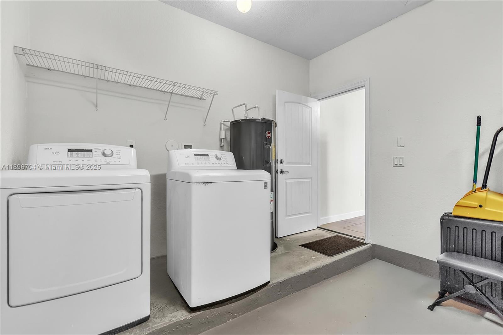 27109 Southwest 133rd Court Homestead, FL 33032 - Photo 40 of 48 a utility room with dryer and washer