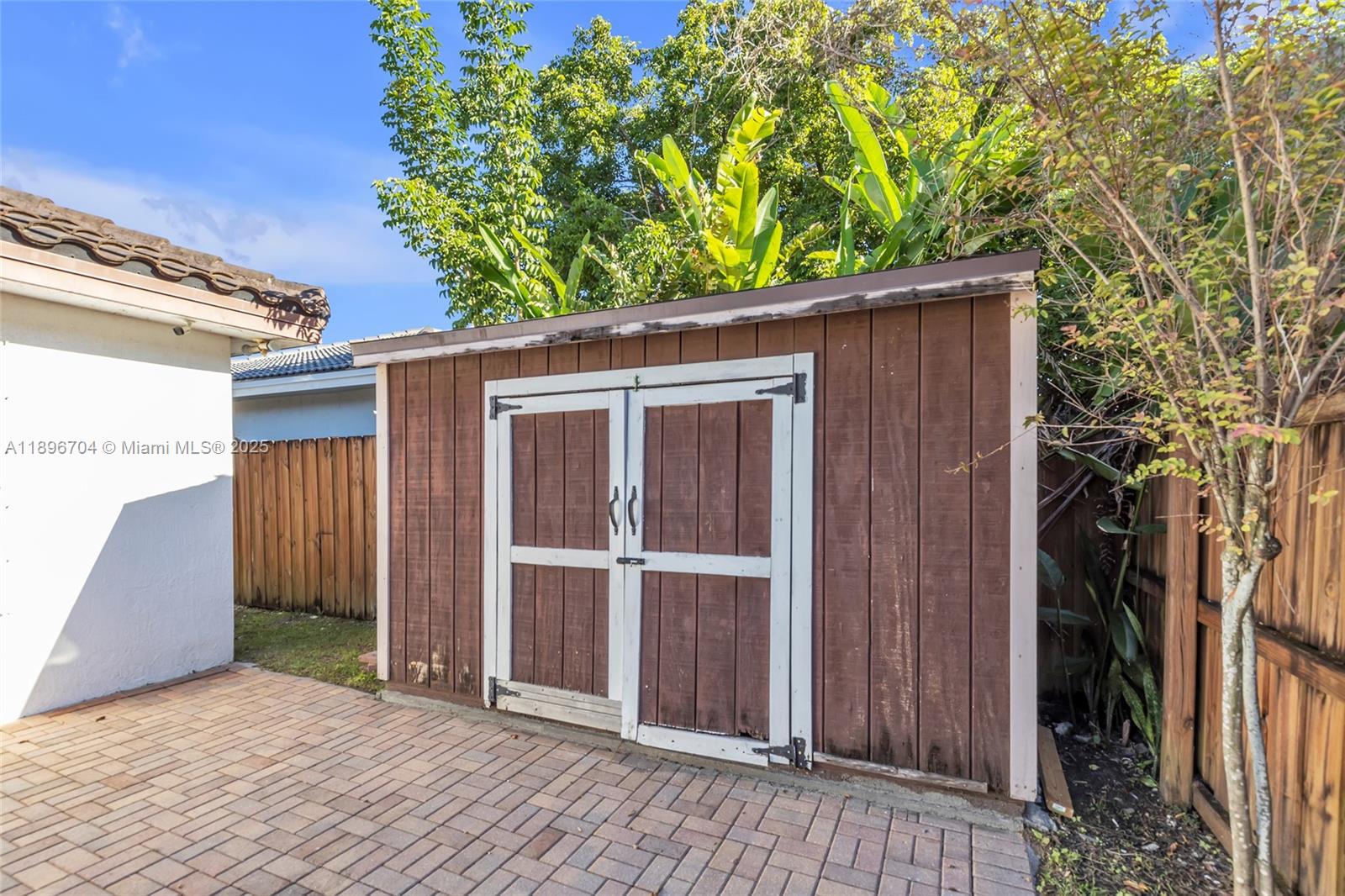 27109 Southwest 133rd Court Homestead, FL 33032 - Photo 44 of 48 a view of backyard with hardwood and door