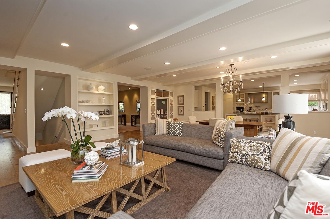 753 Ocampo Drive Pacific Palisades, CA 90272 - Photo 14 of 53 a living room with furniture kitchen view and a dining table