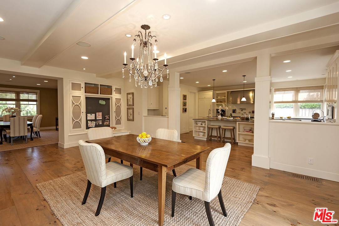 753 Ocampo Drive Pacific Palisades, CA 90272 - Photo 18 of 53 a view of a dining room with furniture and wooden floor