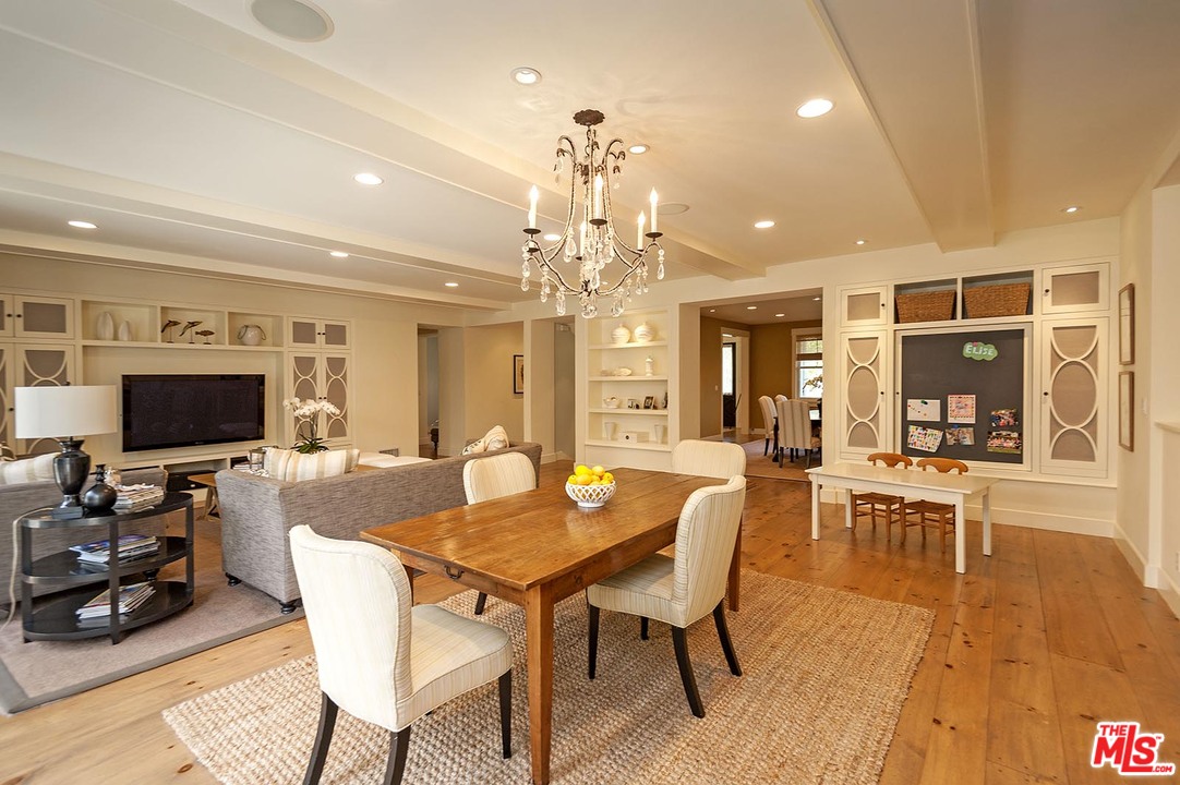 753 Ocampo Drive Pacific Palisades, CA 90272 - Photo 19 of 53 a view of a dining room with furniture and wooden floor