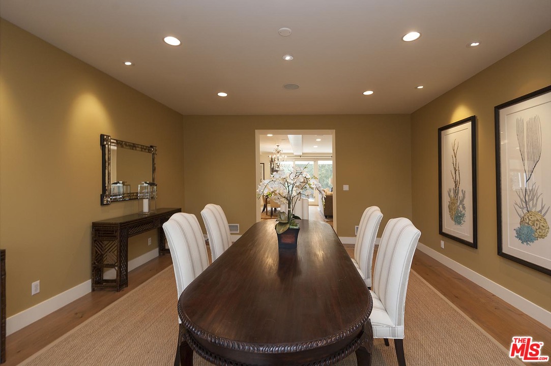753 Ocampo Drive Pacific Palisades, CA 90272 - Photo 27 of 53 a view of a dining room with furniture window and wooden floor