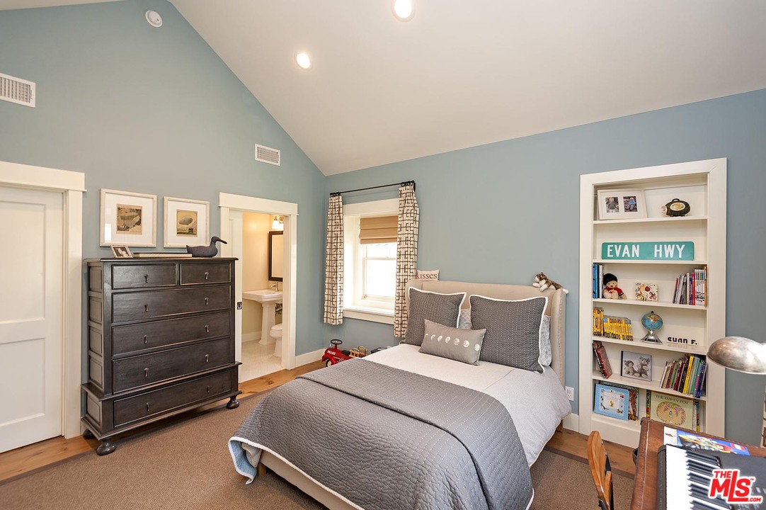 753 Ocampo Drive Pacific Palisades, CA 90272 - Photo 34 of 53 a bedroom with a bed and cabinets