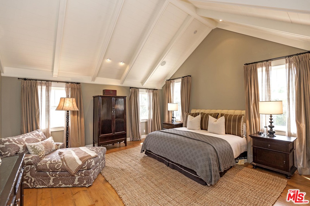 753 Ocampo Drive Pacific Palisades, CA 90272 - Photo 36 of 53 a bedroom with a large bed and a window