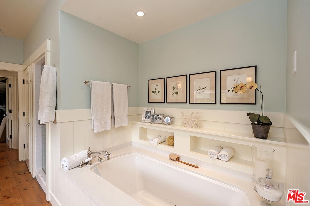 753 Ocampo Drive Pacific Palisades, CA 90272 - Photo 41 of 53 a bathroom with a tub sink and mirror
