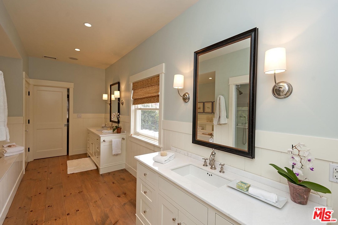 753 Ocampo Drive Pacific Palisades, CA 90272 - Photo 42 of 53 a spacious bathroom with a double vanity sink a mirror and a bathtub