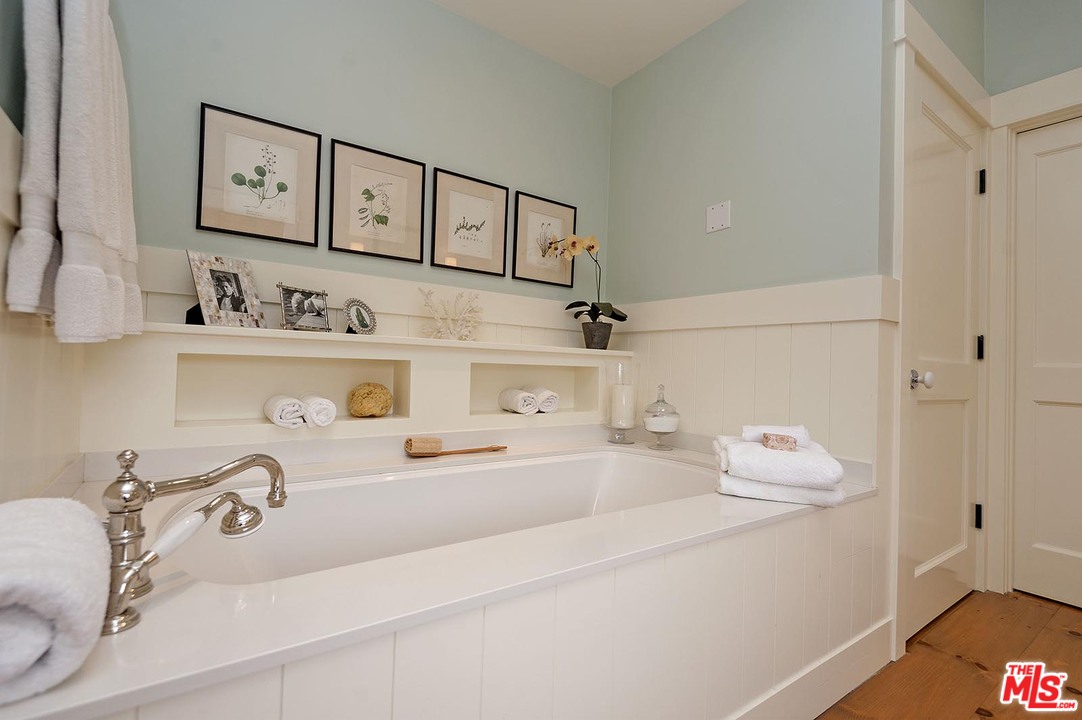 753 Ocampo Drive Pacific Palisades, CA 90272 - Photo 43 of 53 a bathroom with a sink and a mirror