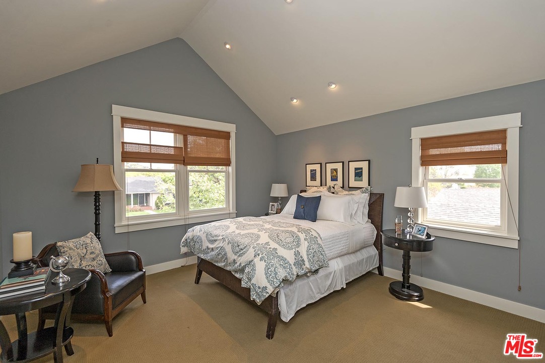 753 Ocampo Drive Pacific Palisades, CA 90272 - Photo 46 of 53 a bedroom with a bed and a window