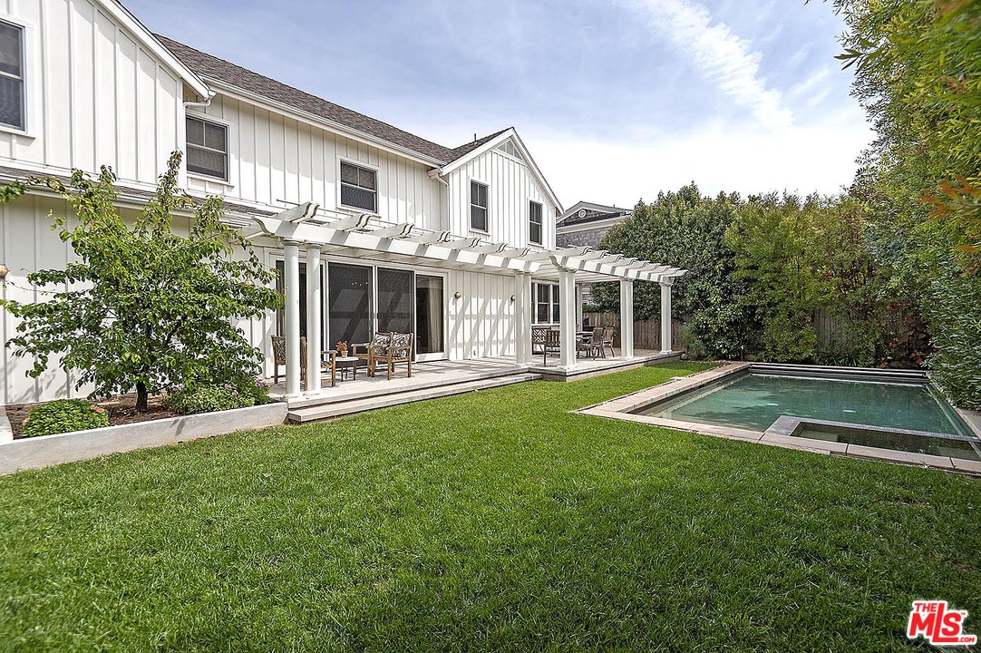 753 Ocampo Drive Pacific Palisades, CA 90272 - Photo 49 of 53 a view of house with a big yard and large trees