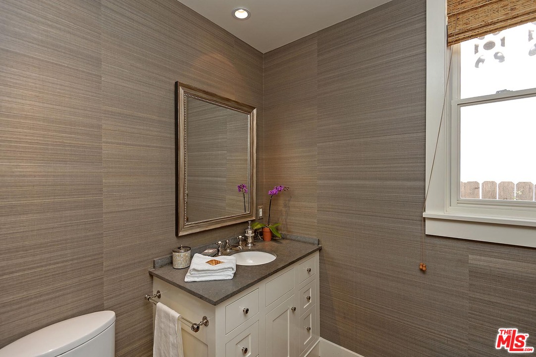 753 Ocampo Drive Pacific Palisades, CA 90272 - Photo 7 of 53 a bathroom with a sink and a mirror