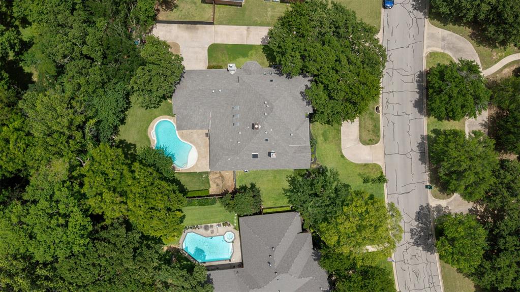 609 Seville Road Denton, TX 76205 - Photo 18 of 40 Lush half acre lot with many trees, pool & outdoor living area.