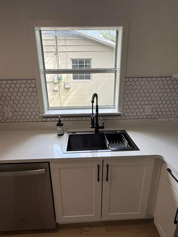 2312 Southwest Fort King Street Ocala, FL 34471 - Photo 10 of 17 a close view of a sink a window and a rug
