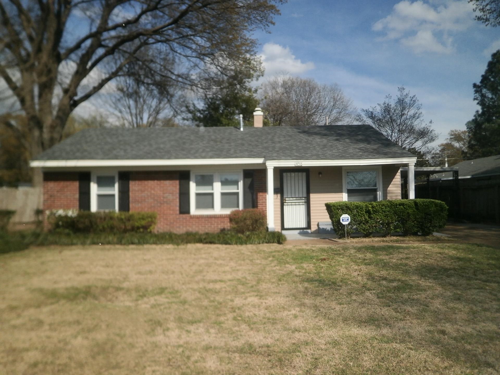 1458 Dearing Road Memphis, TN 38117 - Photo 1 of 11 a front view of a house with a yard