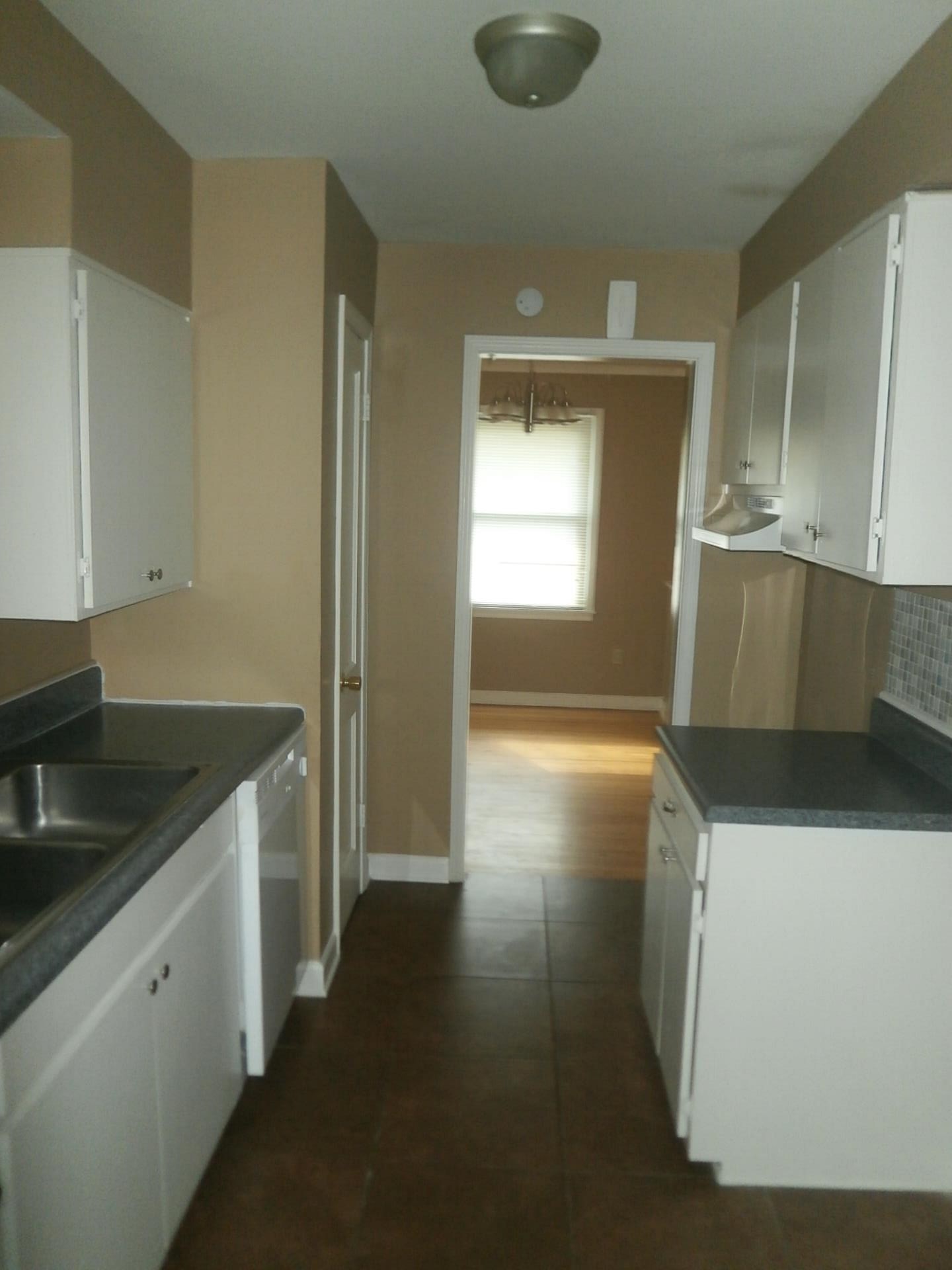 1458 Dearing Road Memphis, TN 38117 - Photo 3 of 11 a kitchen with a sink a stove and cabinets