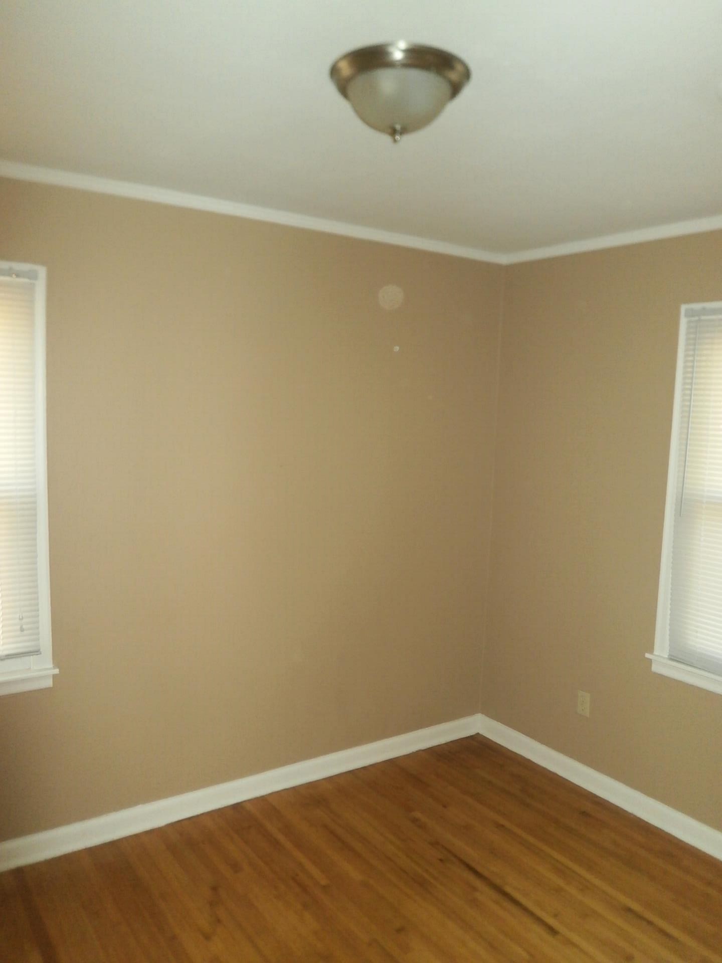 1458 Dearing Road Memphis, TN 38117 - Photo 6 of 11 en empty room with wooden floor and fan