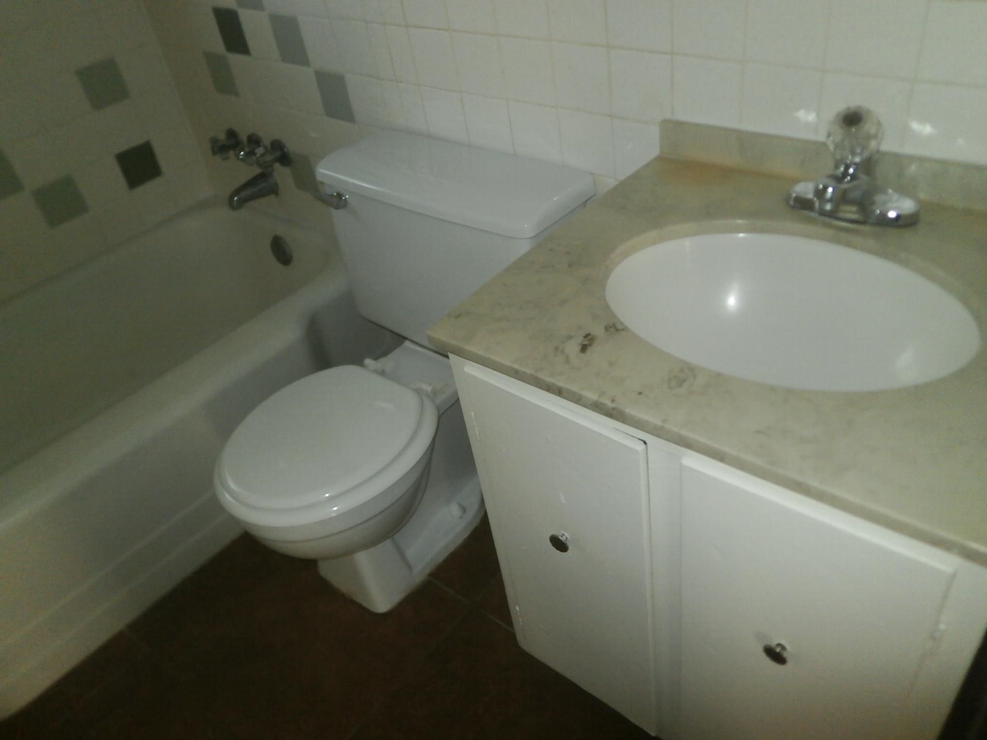 1458 Dearing Road Memphis, TN 38117 - Photo 7 of 11 a bathroom with a sink and toilet
