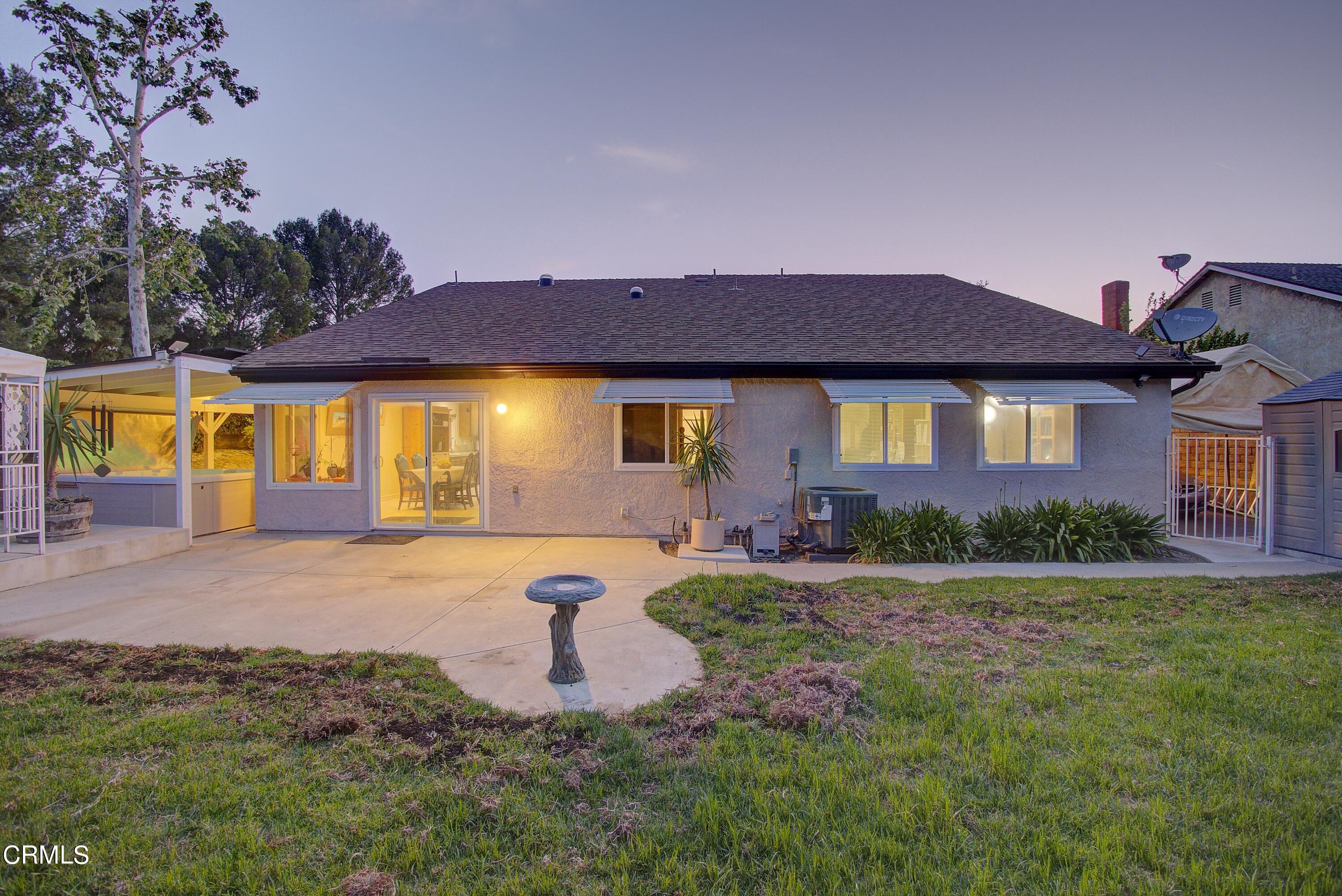 2606 Wheatfield Circle Simi Valley, CA 93063 - Photo 22 of 60 a front view of a house with garden