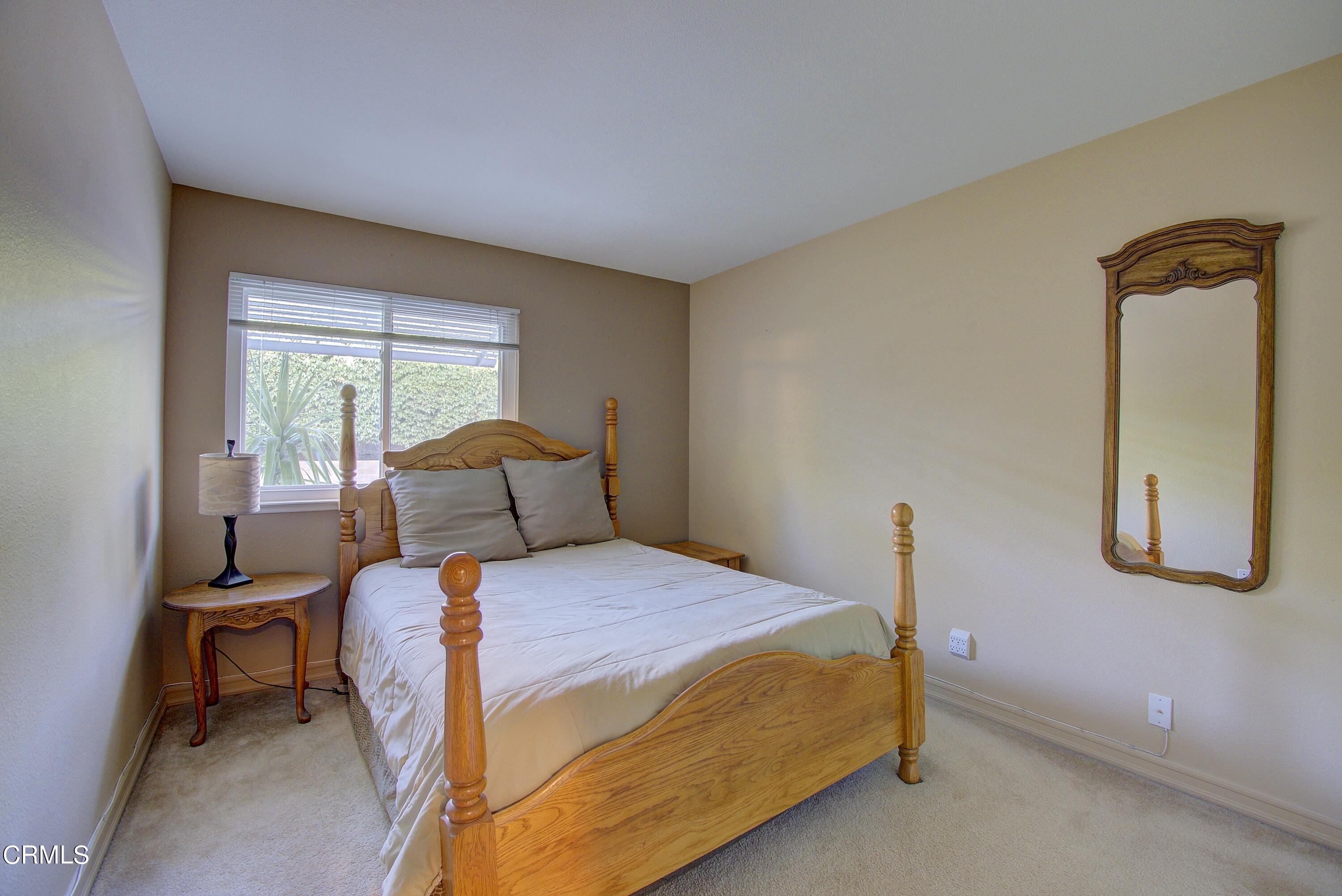 2606 Wheatfield Circle Simi Valley, CA 93063 - Photo 40 of 60 a bedroom with a bed and a window
