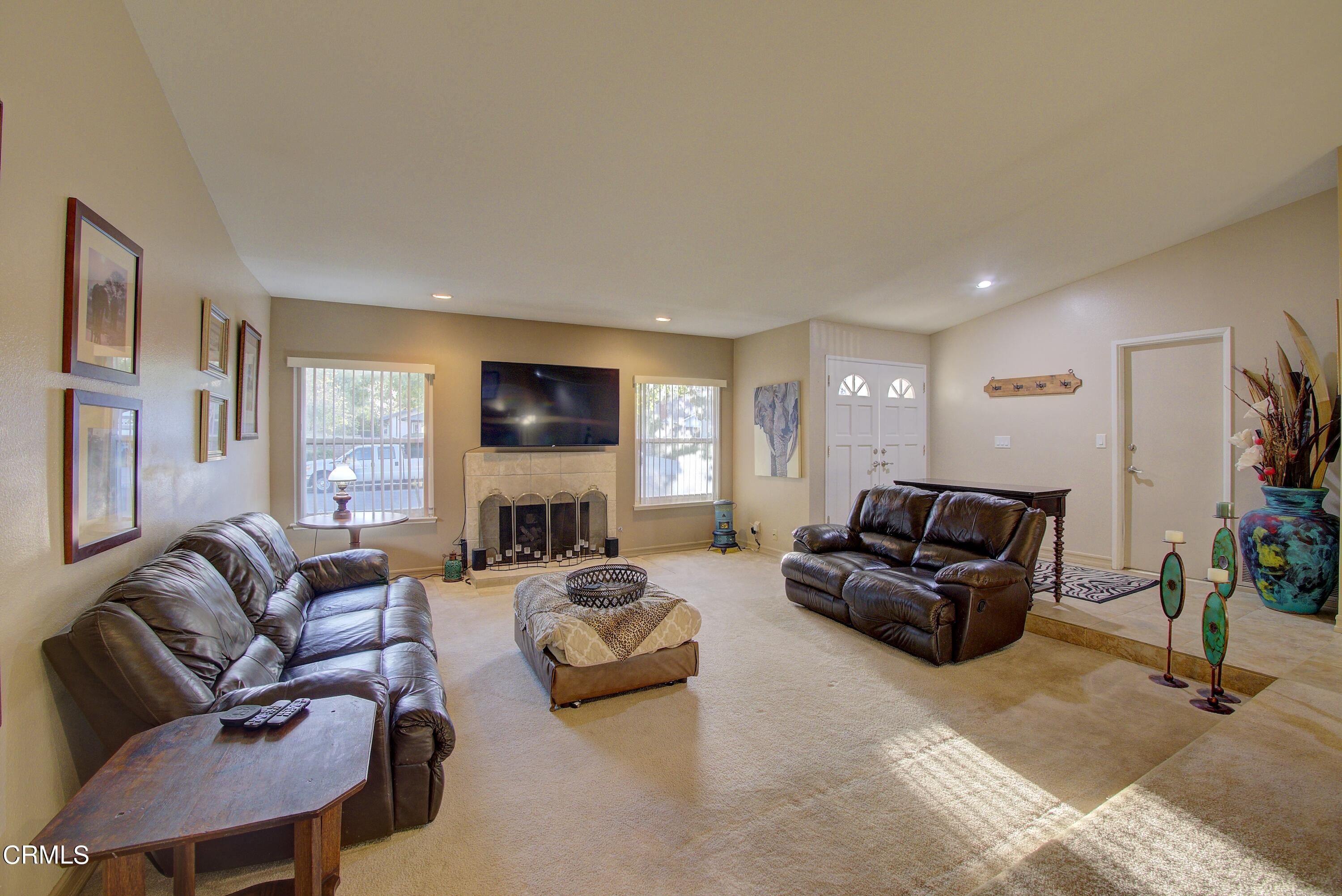 2606 Wheatfield Circle Simi Valley, CA 93063 - Photo 47 of 60 a living room with furniture fireplace and a window