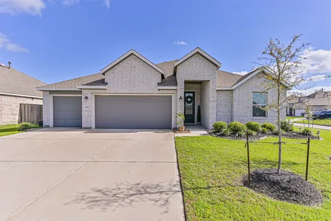 a kitchen with stainless steel appliances granite countertop a refrigerator stove microwave and sink