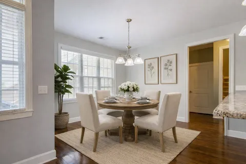 a kitchen with stainless steel appliances granite countertop a refrigerator sink and stove