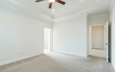 a bathroom with a granite countertop sink vanity and mirror