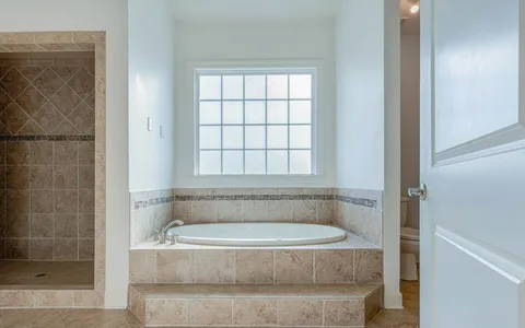 a bed room with a bed and a couch