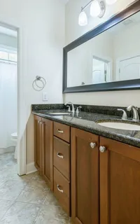 a spacious bedroom with a bed and a window