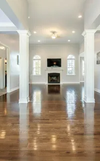 a view of a livingroom with kitchen and sink
