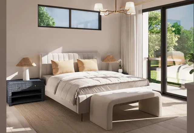 a bedroom with a bed and large window