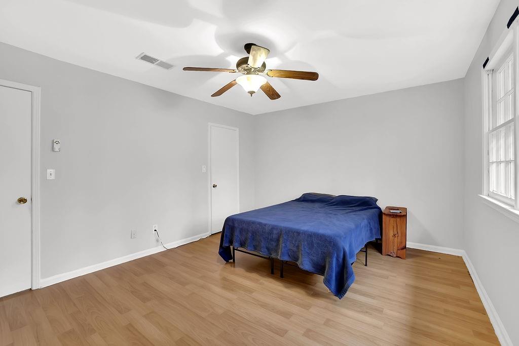 6520 Roswell Road, Unit 62 Atlanta, GA 30328 - Photo 20 of 34 a view of a room with wooden floor closet and chandelier fan