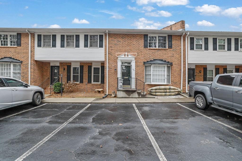 6520 Roswell Road, Unit 62 Atlanta, GA 30328 - Photo 2 of 34 a view of a car park in front of house