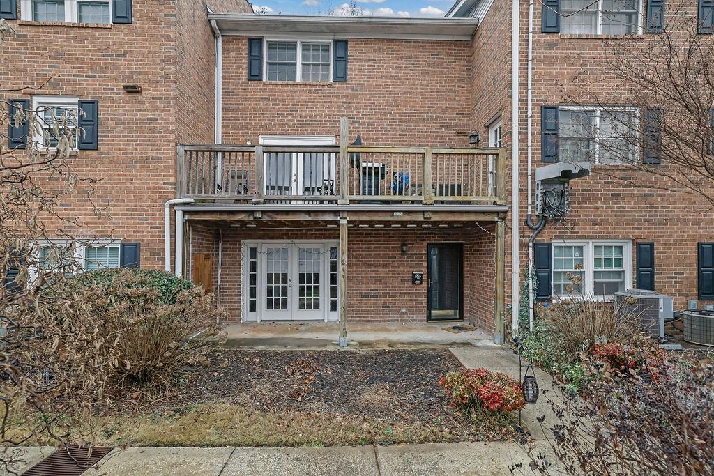 6520 Roswell Road, Unit 62 Atlanta, GA 30328 - Photo 29 of 34 a house that has a lot of windows and plants